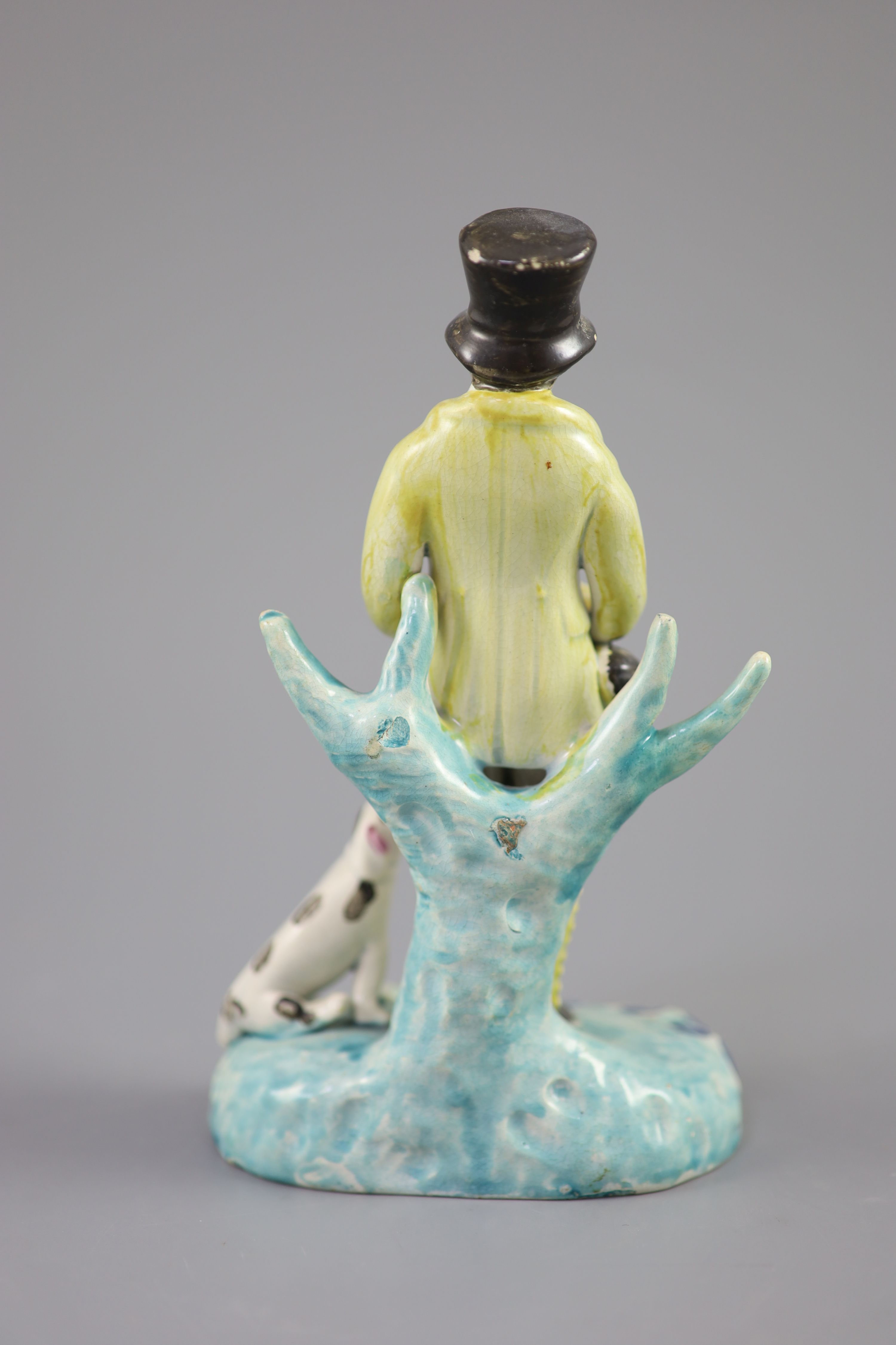 A Staffordshire pearlware group of a huntsman with dog and gun, c.1820-30, 18.5cm high
